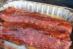 Paint sauce onto ribs