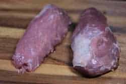 Pork tenderloins on cutting board