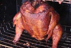 Chicken on grate in smoker