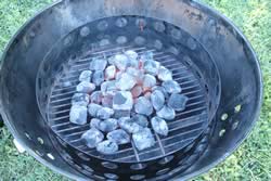 charcoal poured into smoker