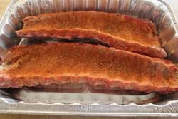 Sprinkle rub on bottom side of ribs