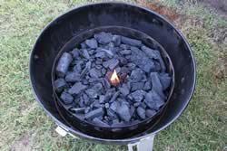 Add charcoal and a piece of firestarter. LIght the firestarter