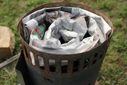 Paper into bottom of charcoal chimney